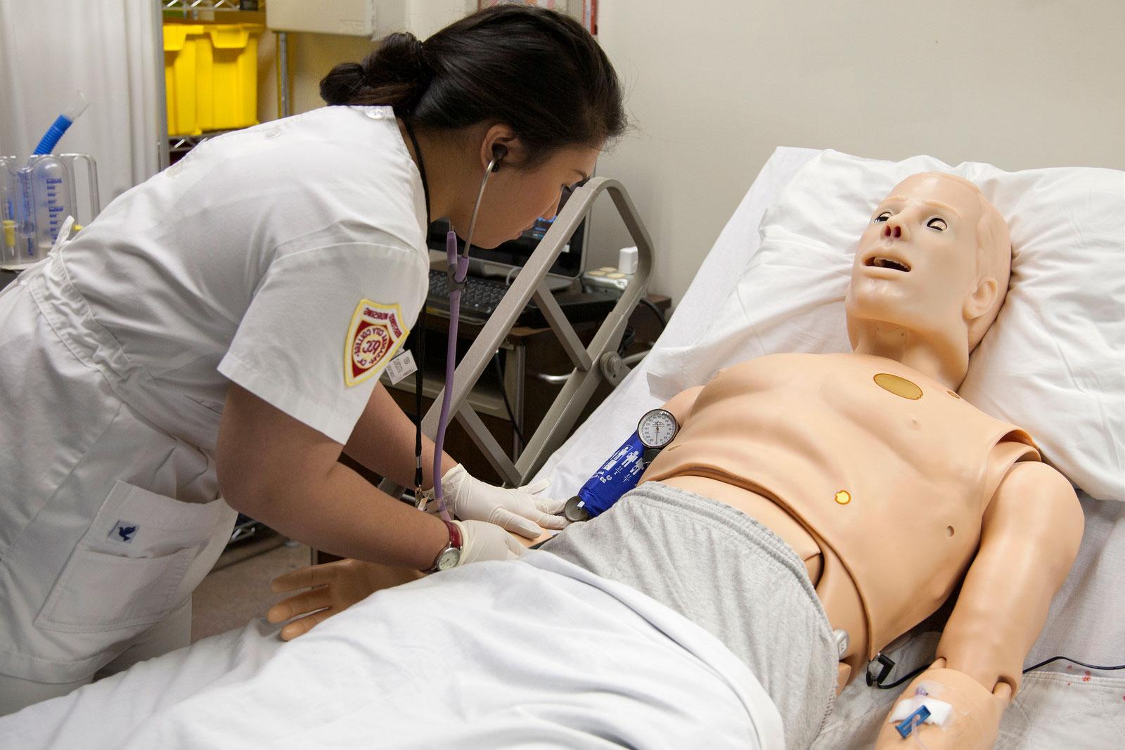 A Registered Nursing student gets practical training during class. 